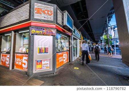 Tokyo cityscape in Japan, including a lottery ticket booth next to the Ginza exit of Shinbashi Station (Chance Center, Ginza Exit of Shinbashi Station) Tokyo cityscape in Japan, including a lottery ticket booth next to the Ginza exit of Shinbashi Station (Chance Center, Ginza Exit of Shinbashi Station) 118790782