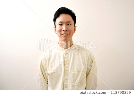 Smiling young casual Asian man looking at camera 118790839