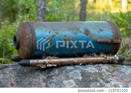 Old vacuum cleaner found in forest highlighting e-waste issues 118791105