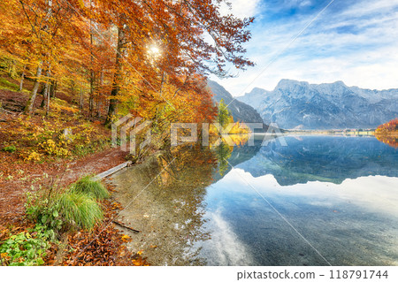 Fabulous autumn scene of sunny morning on Almsee lake. 118791744