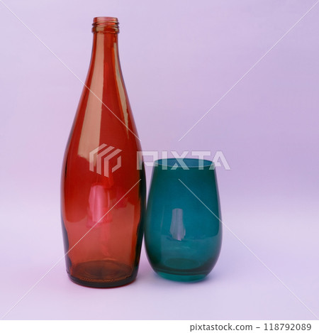Colorful glass bottle and empty glass background Colorful glass bottle and empty glass background 118792089