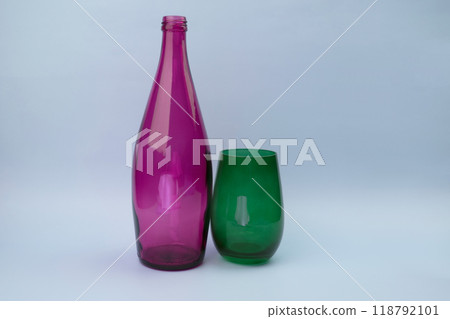 Colorful glass bottle and empty glass background 118792101
