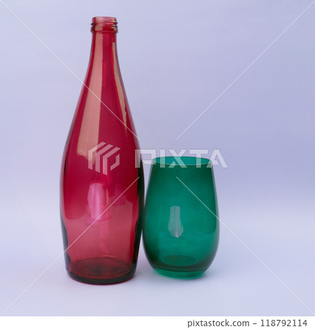 Colorful glass bottle and empty glass background 118792114