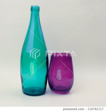 Colorful glass bottle and empty glass background Colorful glass bottle and empty glass background 118792117
