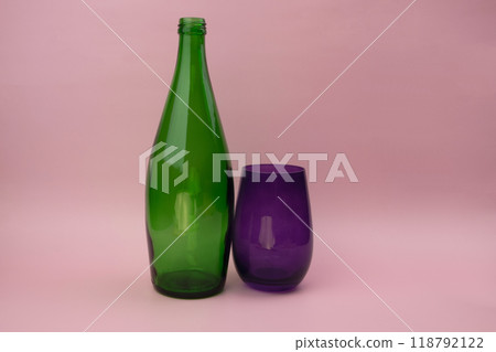 Colorful glass bottle and empty glass background 118792122