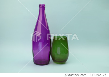 Colorful glass bottle and empty glass background Colorful glass bottle and empty glass background 118792124