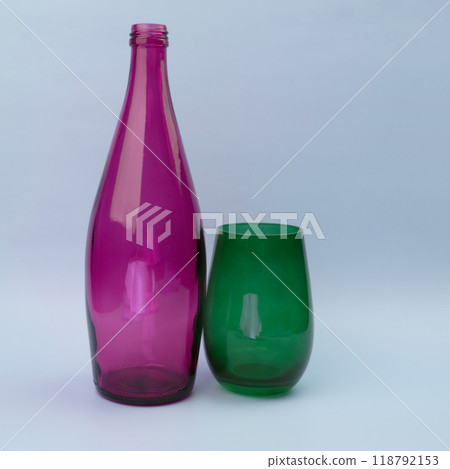 Colorful glass bottle and empty glass background 118792153