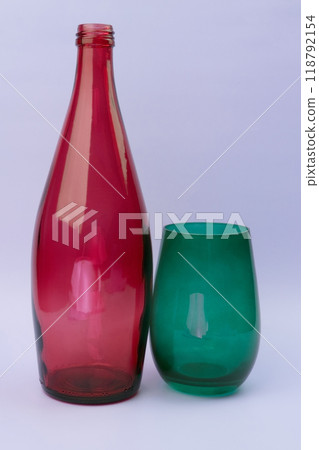 Colorful glass bottle and empty glass background Colorful glass bottle and empty glass background 118792154