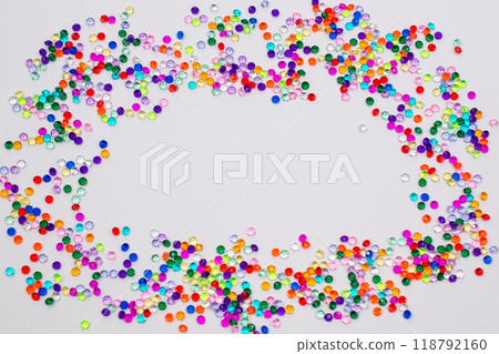 Multicolored tiny faceted crystals on a white background, beautiful colorful texture Multicolored tiny faceted crystals on a white background, beautiful colorful texture 118792160