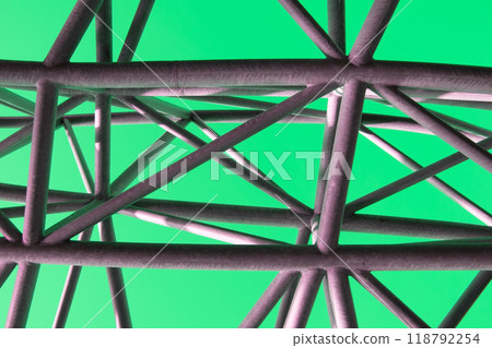 Abstract metal figure on a colorful pink background, artistically welded metal pipes, fragment of scaffolding in NYC Abstract metal figure on a colorful pink background, artistically welded metal pipes, fragment of scaffolding in NYC 118792254