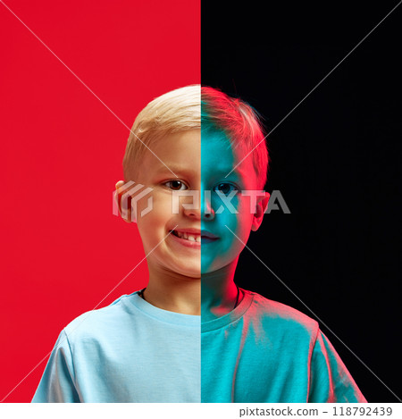 Kids emotions. Half of portrait of child, boy with smiling and serious face against black and red background. Creative conceptual collage. Kids emotions. Half of portrait of child, boy with smiling and serious face against black and red background. Creative conceptual collage. 118792439