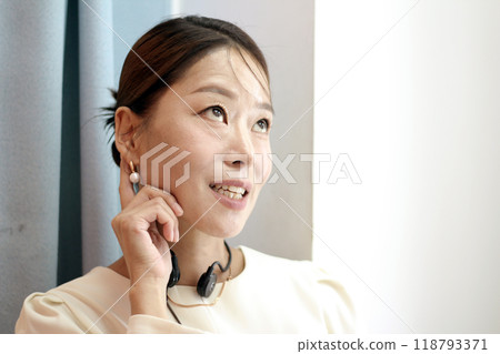 30s business woman posing as a business woman in studio 118793371
