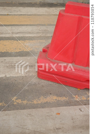 Red, white plastic safety barriers along roads. Ensuring road safety with visible barriers Red, white plastic safety barriers along roads. Ensuring road safety with visible barriers 118793854