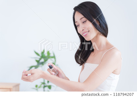 Women wearing perfume Women wearing perfume 118794207