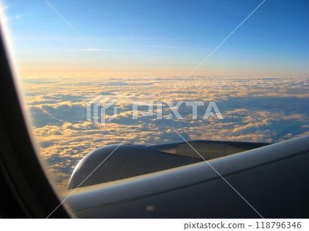 Beautiful view of the sea of clouds seen from the window of an airplane Beautiful view of the sea of clouds seen from the window of an airplane 118796346