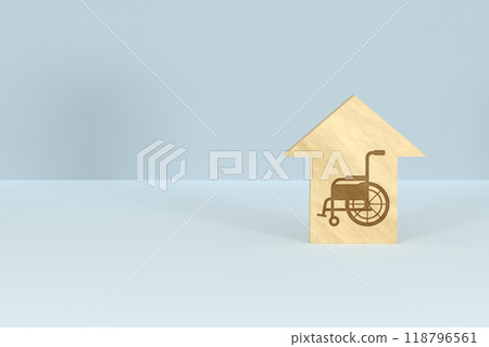 Eye-catching image of a house-shaped wooden block with a wheelchair silhouette Eye-catching image of a house-shaped wooden block with a wheelchair silhouette 118796561