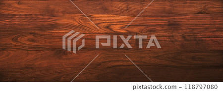 Background image of a horizontal board of reddish brown walnut wood grain Background image of a horizontal board of reddish brown walnut wood grain 118797080