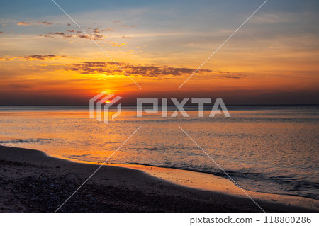 Sandy beach with pebbles of Baltic Sea on Curonian Spit at sunset. Kaliningrad region. Russia 118800286