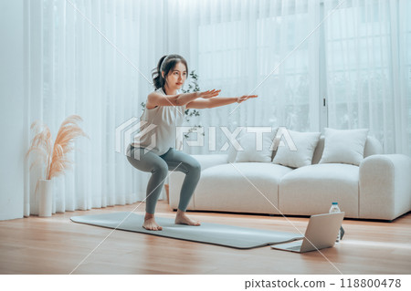 Young Asian beautiful woman doing aerobic exercise at home 118800478
