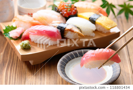 Dip sushi in soy sauce 118801434