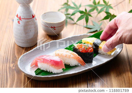 Sushi and sake served on a plate 118801789