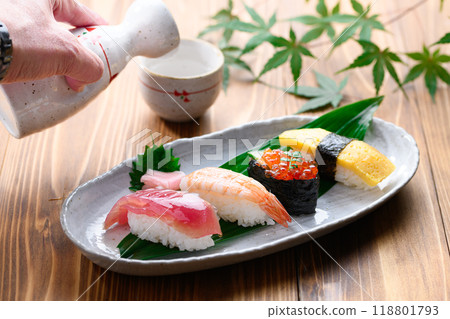 Sushi and sake served on a plate 118801793