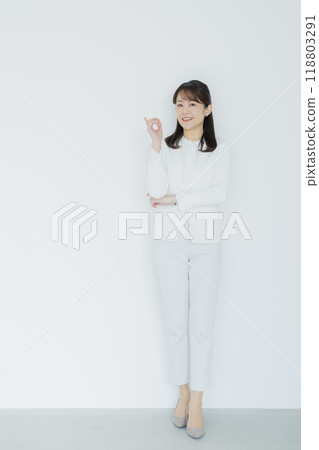 Woman in a white suit 118803291