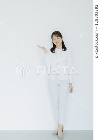 Woman in a white suit 118803292