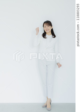 Woman in a white suit 118803293