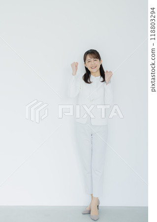 Woman in a white suit Woman in a white suit 118803294