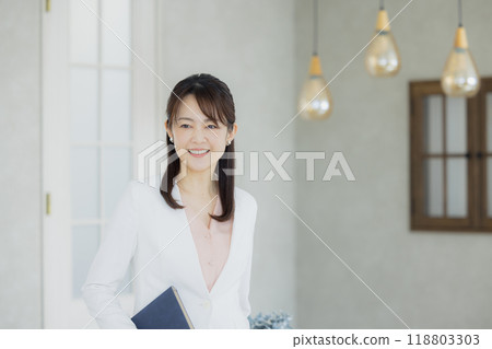 Woman in a white suit Woman in a white suit 118803303