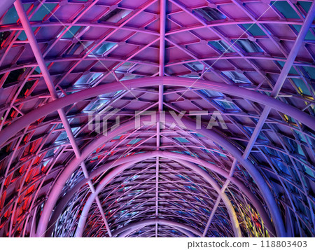A stunning tunnel with vibrant purple and blue ceiling lights A stunning tunnel with vibrant purple and blue ceiling lights 118803403