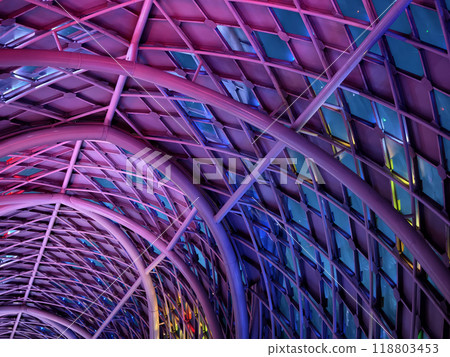 A stunning tunnel with vibrant purple and blue ceiling lights 118803453