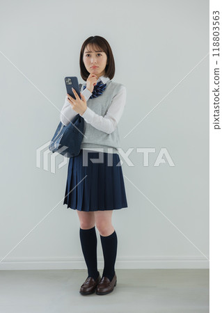 High school girl with a smartphone High school girl with a smartphone 118803563