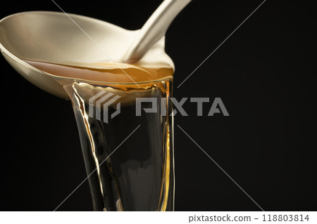 Dashi: Scoop out the dashi with a ladle. 118803814