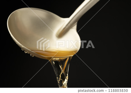 Dashi: Scoop out the dashi with a ladle. 118803830