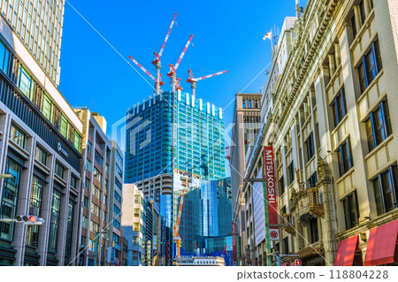 Tokyo cityscape, Japan. September. Muromachi 2-chome. Coredo Muromachi 3 (left) and Mitsukoshi. In the background is the redevelopment project of Nihonbashi 1-chome. Tokyo cityscape, Japan. September. Muromachi 2-chome. Coredo Muromachi 3 (left) and Mitsukoshi. In the background is the redevelopment project of Nihonbashi 1-chome. 118804228