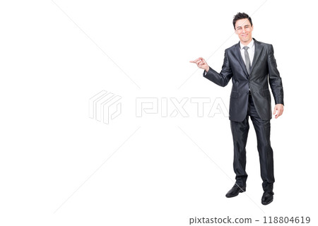 Smiling man pointing aside in studio. White background. 118804619