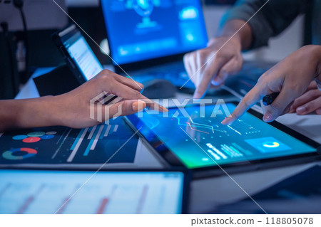 close up hand team of financial discussion fintech  technology planning, analyzing digital financial data and strategy in a modern office at night 118805078