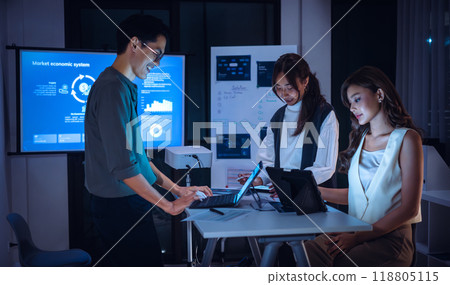 team of financial discussion budget planning, analyzing digital financial data and strategy in a modern office at night team of financial discussion budget planning, analyzing digital financial data and strategy in a modern office at night 118805115