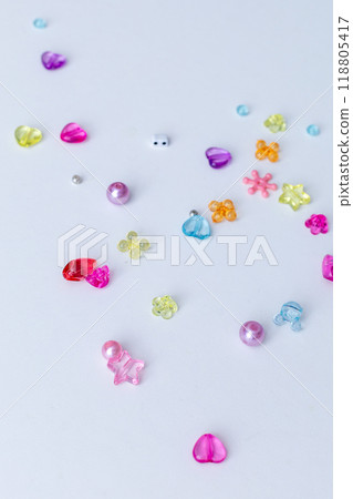 Rainbow shaped box with multi-colored beads for children's needlework and crafts. DIY art activity for kids. Motor skills, creativity and hobby Rainbow shaped box with multi-colored beads for children's needlework and crafts. DIY art activity for kids. Motor skills, creativity and hobby 118805417