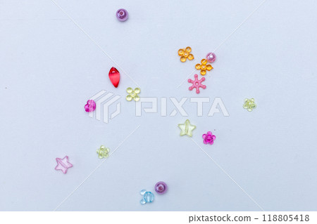 Rainbow shaped box with multi-colored beads for children's needlework and crafts. DIY art activity for kids. Motor skills, creativity and hobby 118805418