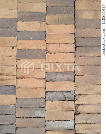 a street cobblestone brick pavers sidewalk row bricks road path walkway driveway. a street cobblestone brick pavers sidewalk row bricks road path walkway driveway. 118805457
