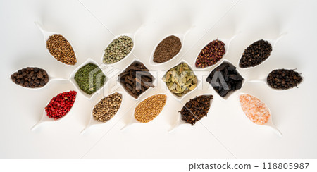 Various spices in porcelain bowls on a white background 118805987
