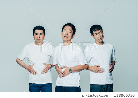 Middle-aged man worried about his stomach 118806336