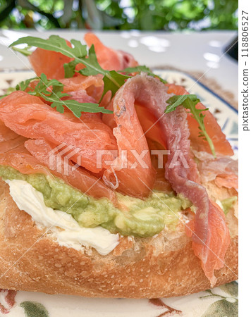Gourmet Avocado and Salmon Toast with Fresh Arugula. High quality photo 118806527