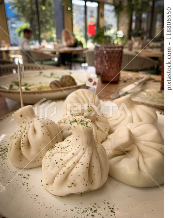Close-up of Fresh Steamed Dumplings on a Restaurant Table. High quality photo Close-up of Fresh Steamed Dumplings on a Restaurant Table. High quality photo 118806550