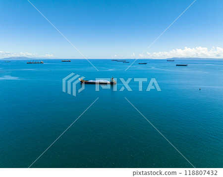 Aerial view of cargo ship in blue sea. Skyline over ocean. Mindanao, Philippines. Seascape. 118807432