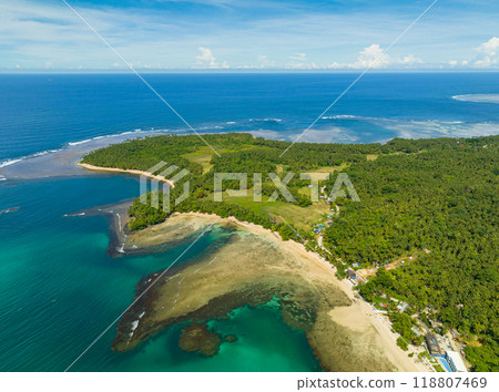 White sand shoreline and the deep blue sea surrounded. Mindanao, Philippines. Seascape. White sand shoreline and the deep blue sea surrounded. Mindanao, Philippines. Seascape. 118807469