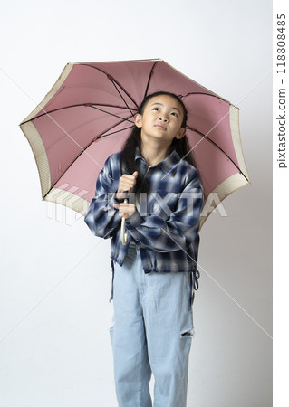 Elementary school girls popping umbrellas Elementary school girls popping umbrellas 118808485